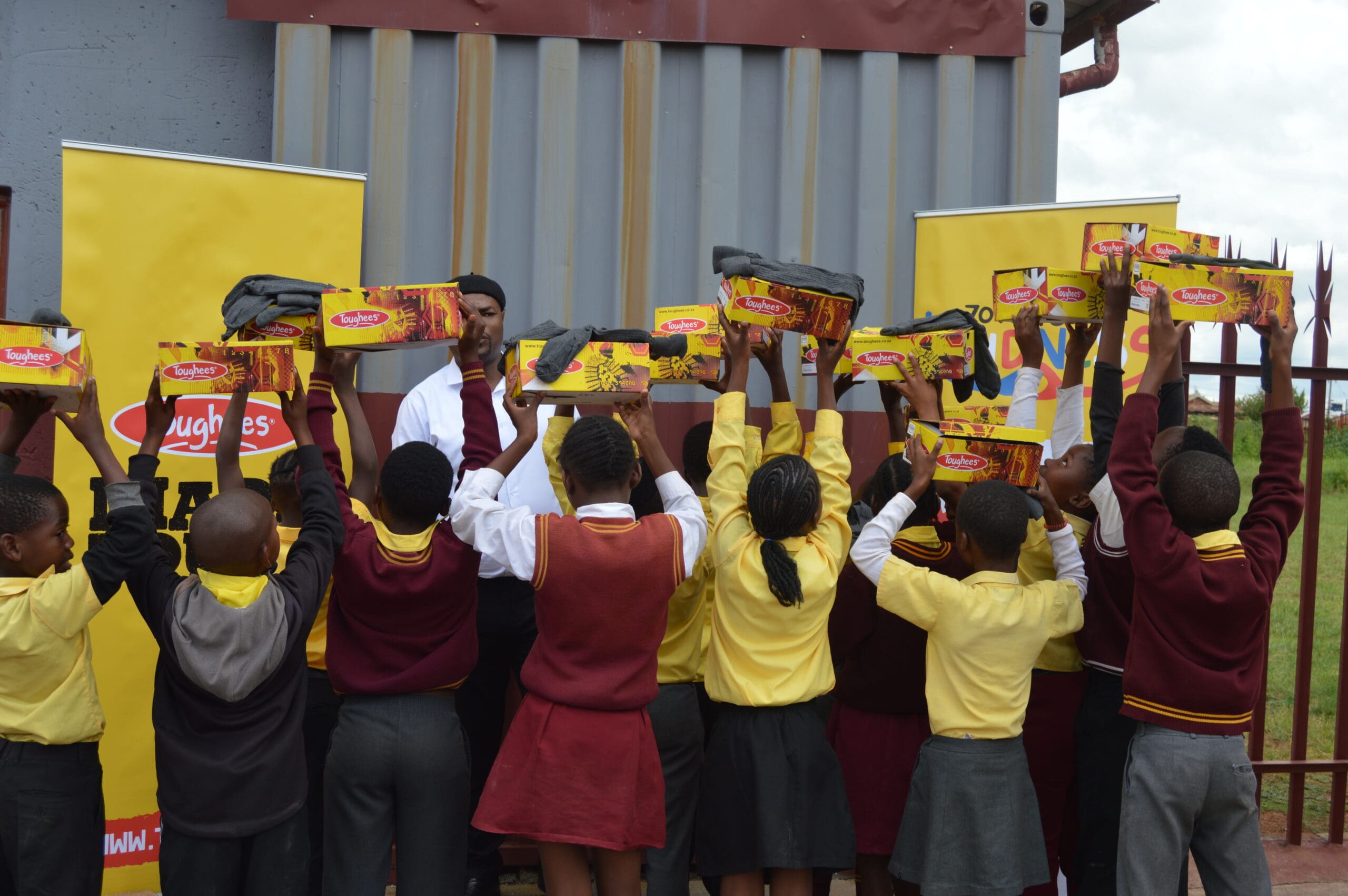 Merchants of Light donates school shoes to Isiboniso Primary